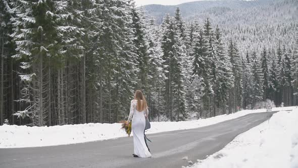 Couple Walking in the Winter Forest