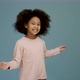 Portrait of cheerful little girl with curly hair smiling funny and dancing joyfully - VideoHive Item for Sale