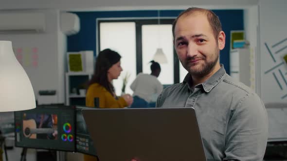 Video Editor Worker Standing in Front of Camera Smiling