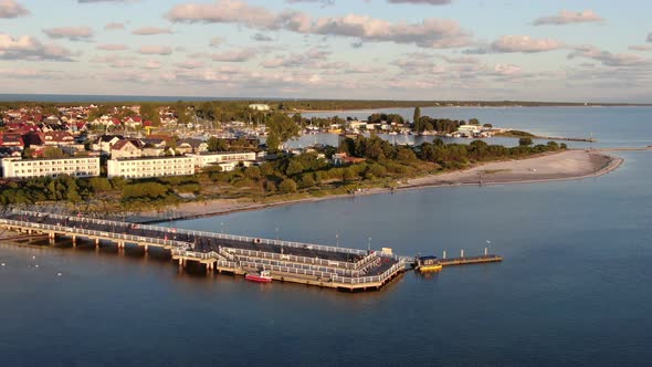 Flying over the pier in Jastarnia on Hel peninsula at the Baltic Sea in Poland