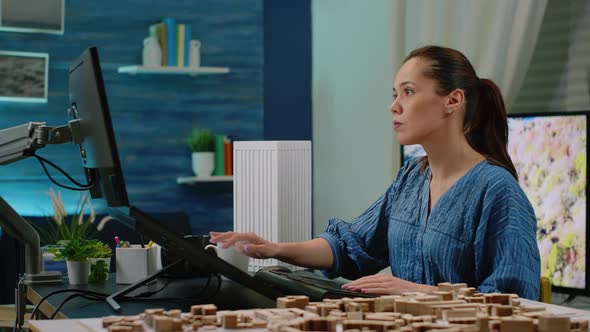 Woman Working As Architect Analyzing Virtual Maquette