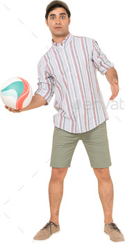 a man holding a volley ball in his hand