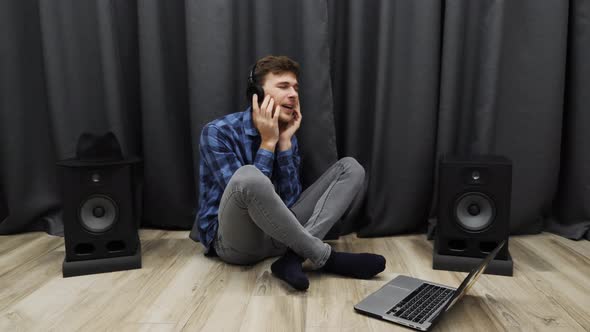 Male in headphones listening to music