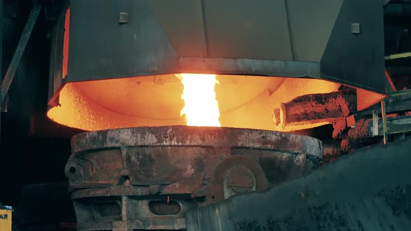 Molten Copper is Pouring Into a Steel Ladle