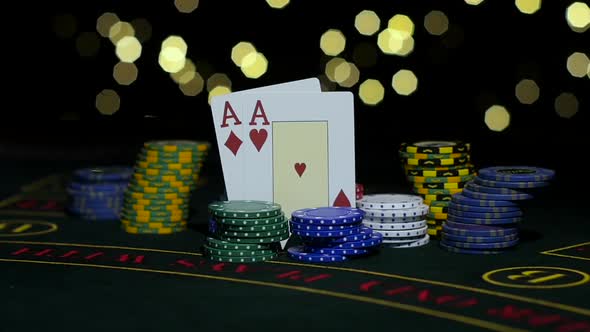 Poker Chips and Two Aces. Close Up. Slow Motion