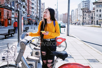tphone beside bike share station.