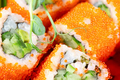 A piece of sushi or rolls with red caviar and sprouted herbs - PhotoDune Item for Sale