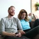 Happy Romantic Couple Smiling Having Fun and Watching Tv - VideoHive Item for Sale