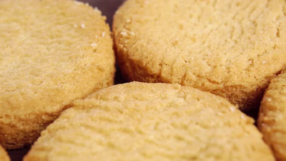 Stacked round shortbread biscuits. Macro. Slow rotation