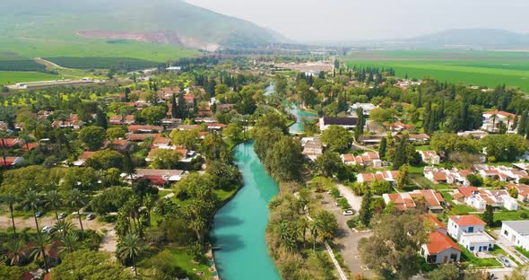 Aerial view of the town with hills in the background and Kibbutzim Stream.