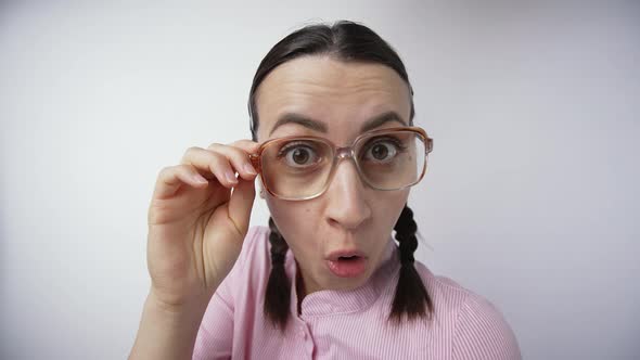 Surprised Nerdy Woman in Glasses