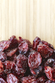 dried cranberries on a wooden background - PhotoDune Item for Sale