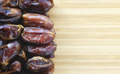 dried dates on a wooden background - PhotoDune Item for Sale