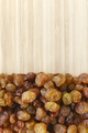 small raisins on a wooden background - PhotoDune Item for Sale