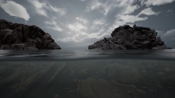 Half Underwater in Northern Sea with Rocks