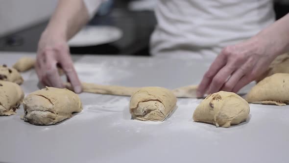 woman in kitchen kneading dough for bread and pizza stock video