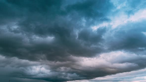 Dramatic Sky During Rain Above Rural Landscape Field