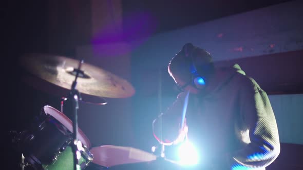 Drummer Playing Drums in the Nightclub