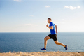 male runner run trail on seashore - PhotoDune Item for Sale