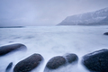 Waves of Norwegian sea surging on stone rocks. Long exposure - PhotoDune Item for Sale