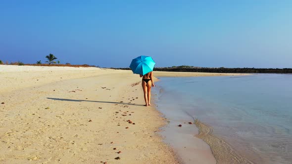Girls enjoying life on paradise coastline beach journey by turquoise sea and white sand background o