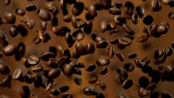 Roasted Coffee Beans Falling Down in Super Slow Motion