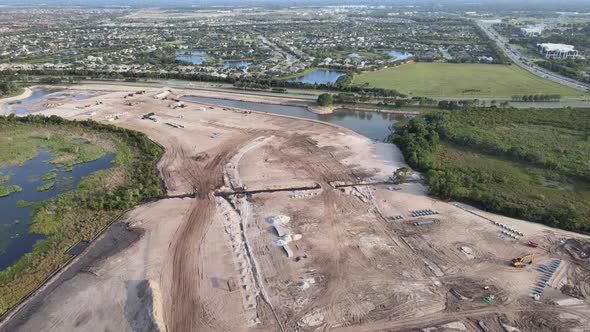 aerial circling South Florida, land development, and installation of infrastructure for a new neighb