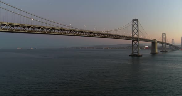 Pan Shot of the Oakland Bay Bridge and San Francisco Skyline at Dusk