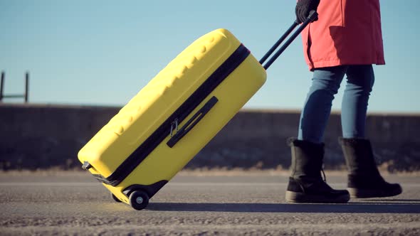 Walking With Yellow Travel Bag. Wife Left Her Husbands After Quarrel. Traveler Transportation.