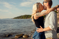 Young Blond Woman Smooching Boyfriend At Beach - PhotoDune Item for Sale