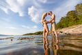 Young Couple Holding Hands When Standing In Sea - PhotoDune Item for Sale