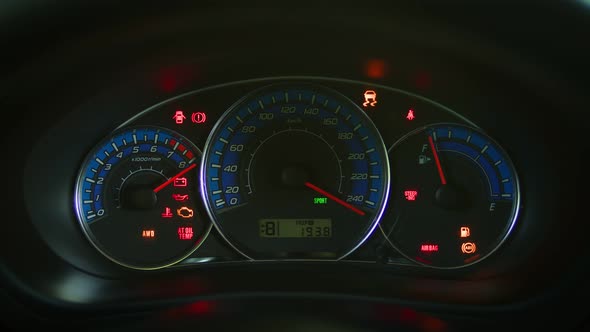 Car Dashboard Lighting Up with Signal Lights