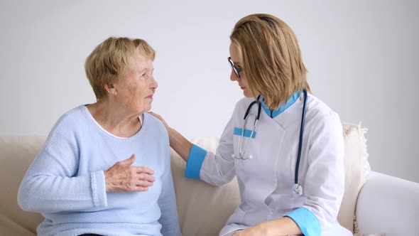 Doctor Explaining Diagnosis To Her Female Senior Patient With Complaints