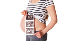 Pregnant woman standing and holding her ultrasound baby scan - PhotoDune Item for Sale