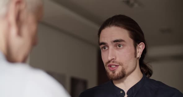 Son Talking with Father During Visit