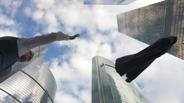 Stressed Young Businessman Throws His Suit Jacket Away 