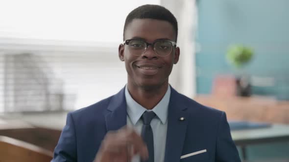 Young African Businessman Showing OK Sign