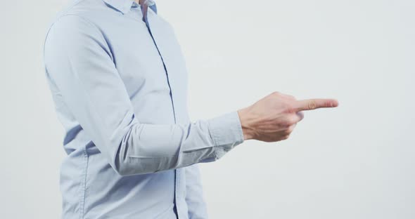 Side view of a man pointing with his finger