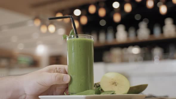 a Glass of Juice on the Table