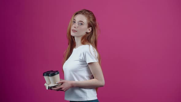 The Charismatic Young Woman Returns From the Profile with Two Coffees and Spreads Them Smiling in