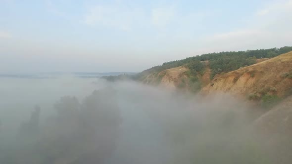 Aerial Shot of Beautiful Natural Landscape. Amazing Scenic View on Valley Covering By Thick Fog