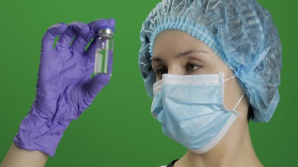 Female Scientist Holding Ampoule in Hand, New Medication Developing, Vaccination