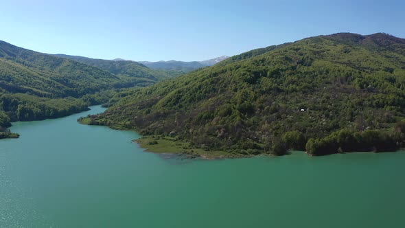 Glittering Waters Of Teleajen River Flowing To Maneciu Dam In Prahova County, Romania. wide shot, pa