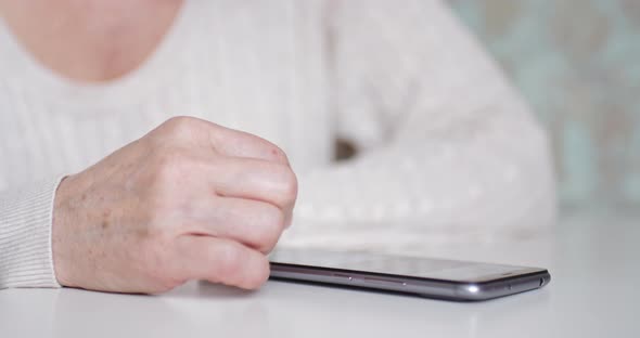 Women's Hands with a Smartphone