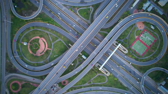 4K : Aerial Hyper lapse drone view of road junction with moving cars.