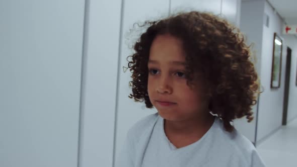 Close-up of African american disabled boy walking in corridor at hospital 4k