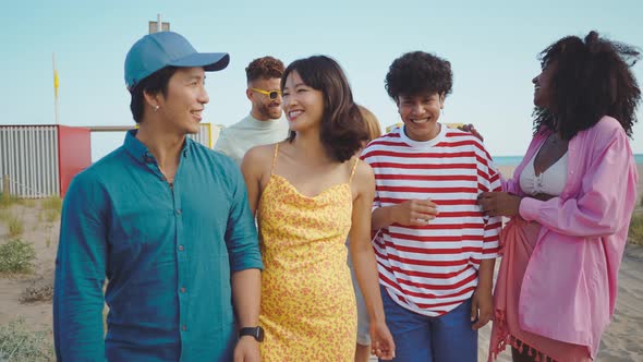 Group of friends having fun on the beach.