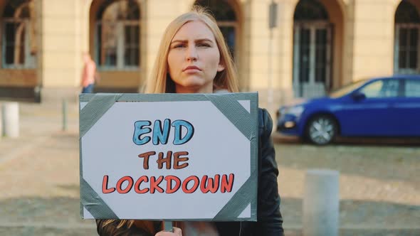 Young Woman Asking To End Lockdown on Protest March