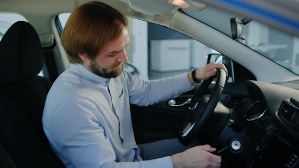 The Manager Tests the Car Before Selling It at the Dealership