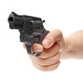 Hand holding pistol - PhotoDune Item for Sale